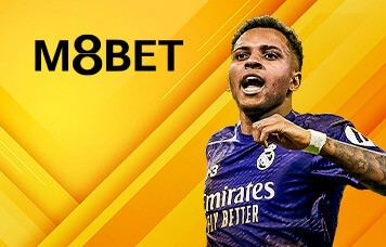 MWIN8 M8Bet sportsbook featuring a Real Madrid football player in a purple jersey on a yellow background.